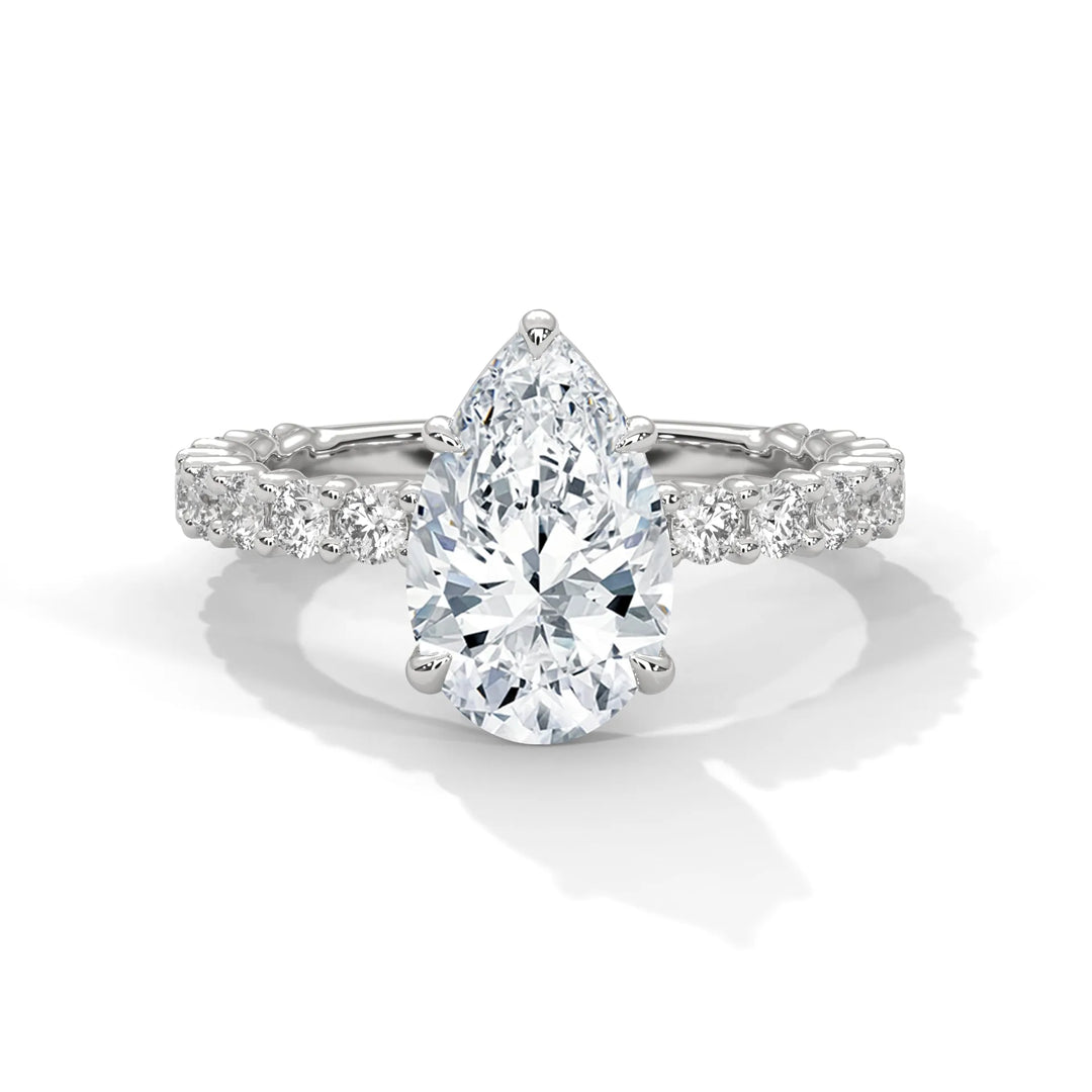 A stunning pear cut diamond engagement ring in a bubble setting, crafted from 14k white gold for a luxurious touch.