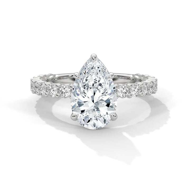 A stunning pear cut diamond engagement ring in a bubble setting, crafted from 14k white gold for a luxurious touch.