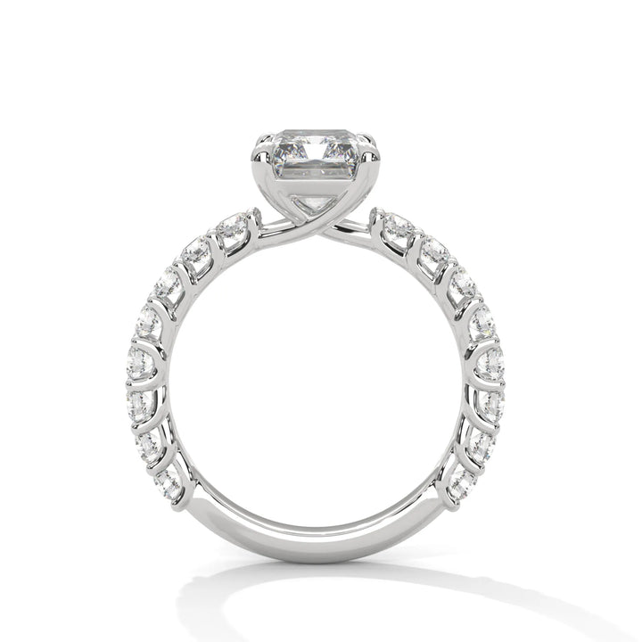 A white gold engagement ring with a diamond center in a bubble setting, crafted from 14k gold and featuring an radiant shape.