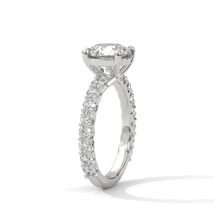 An elegant round diamond engagement ring crafted in 14k white gold, highlighted by a bubble setting for a captivating 3D appearance.