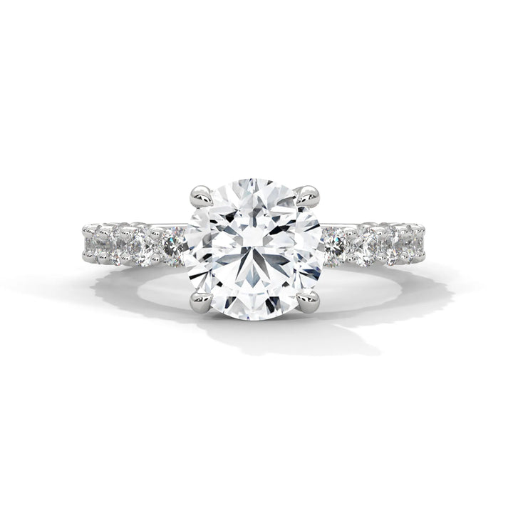 A stunning round cut diamond engagement ring in a bubble setting, crafted from 14k white gold for a luxurious touch.