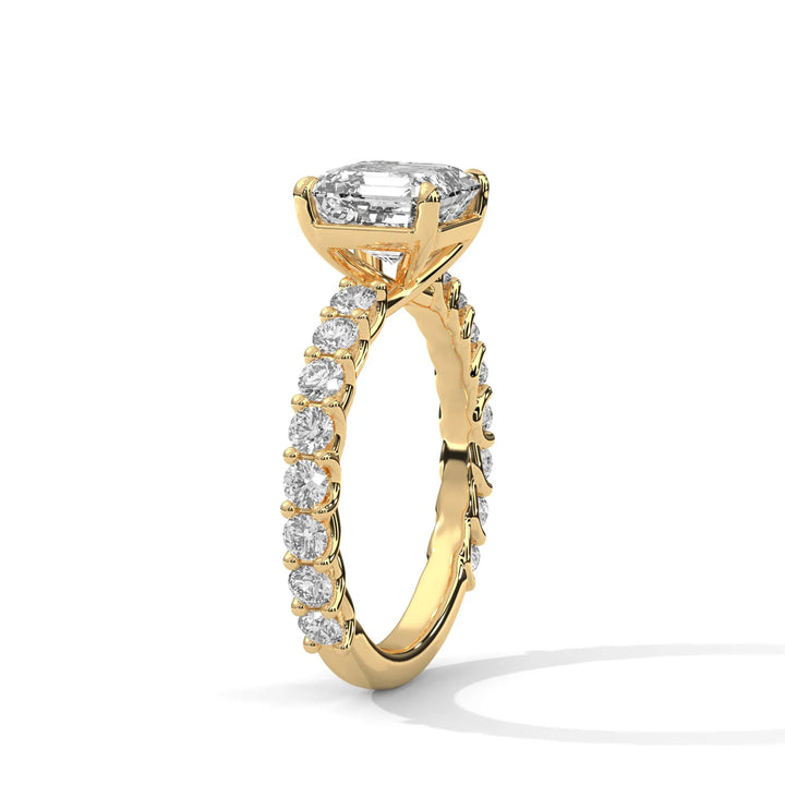 An elegant asscher diamond engagement ring crafted in 14k yellow gold, highlighted by a bubble setting for a captivating 3D appearance.