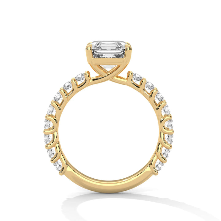 A yellow gold engagement ring with a diamond center in a bubble setting, crafted from 14k gold and featuring an asscher shape.