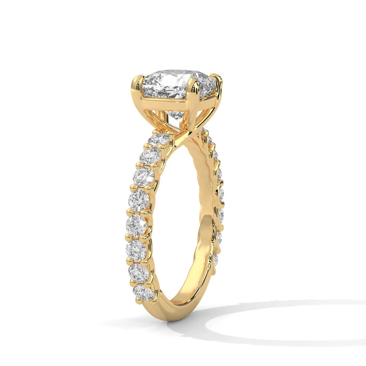 An elegant cushion diamond engagement ring crafted in 14k yellow gold, highlighted by a bubble setting for a captivating 3D apcushionance.