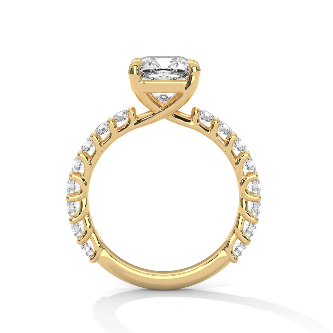 A yellow gold engagement ring with a diamond center in a bubble setting, crafted from 14k gold and featuring an cushion shape.