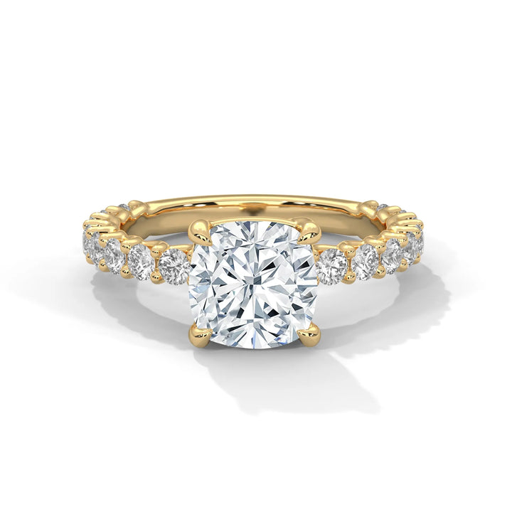 A stunning cushion cut diamond engagement ring in a bubble setting, crafted from 14k yellow gold for a luxurious touch.