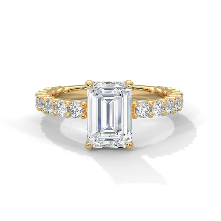 A stunning emerald cut diamond engagement ring in a bubble setting, crafted from 14k yellow gold for a luxurious touch.