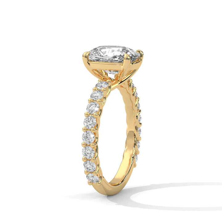 An elegant long cushion diamond engagement ring crafted in 14k yellow gold, highlighted by a bubble setting for a captivating 3D appearance.