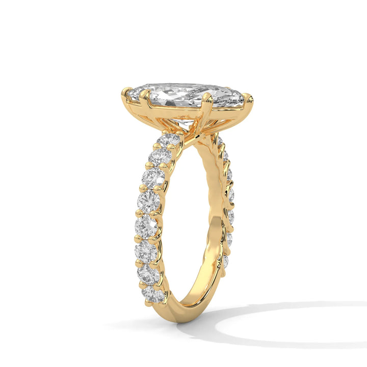 An elegant marquise diamond engagement ring crafted in 14k yellow gold, highlighted by a bubble setting for a captivating 3D appearance.