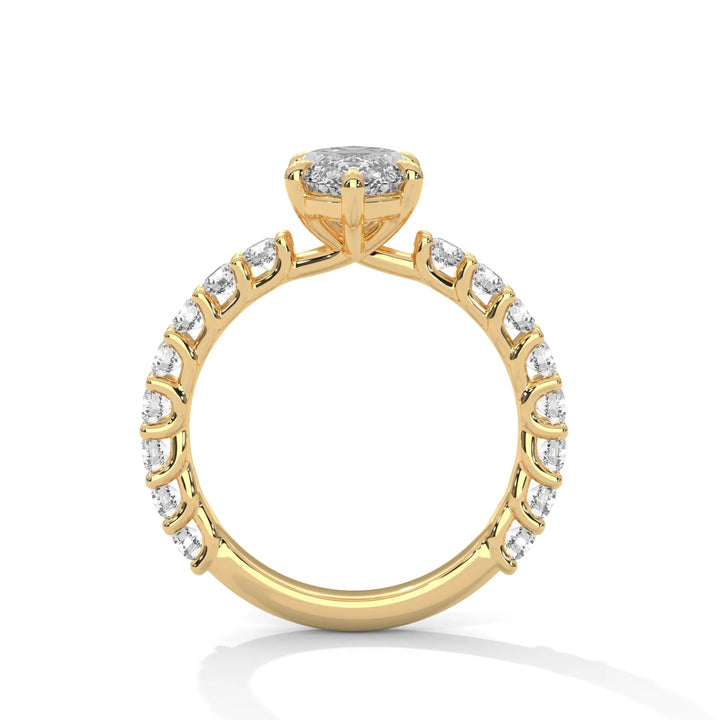 A yellow gold engagement ring with a diamond center in a bubble setting, crafted from 14k gold and featuring an marquise shape.