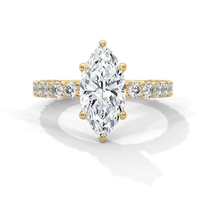 A stunning marquise cut diamond engagement ring in a bubble setting, crafted from 14k yellow gold for a luxurious touch.