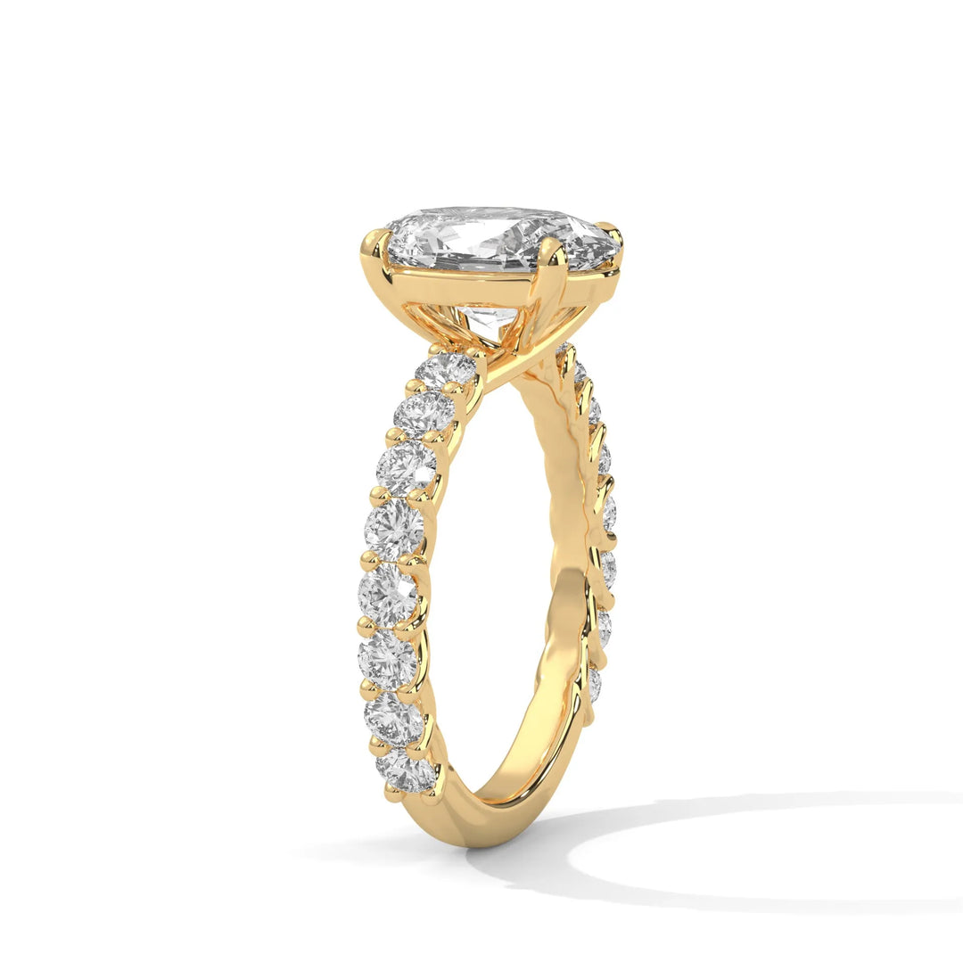 An elegant oval diamond engagement ring crafted in 14k yellow gold, highlighted by a bubble setting for a captivating 3D appearance.