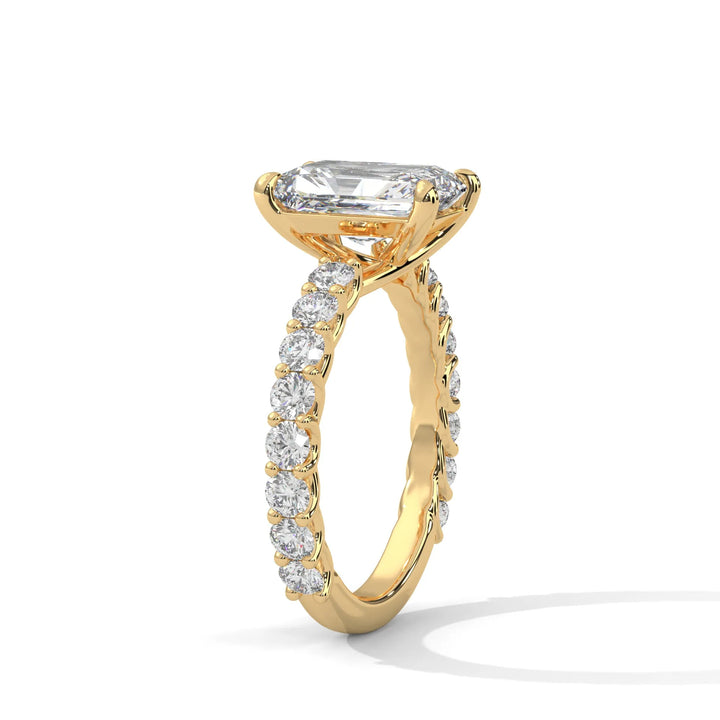 An elegant radiant diamond engagement ring crafted in 14k yellow gold, highlighted by a bubble setting for a captivating 3D appearance.