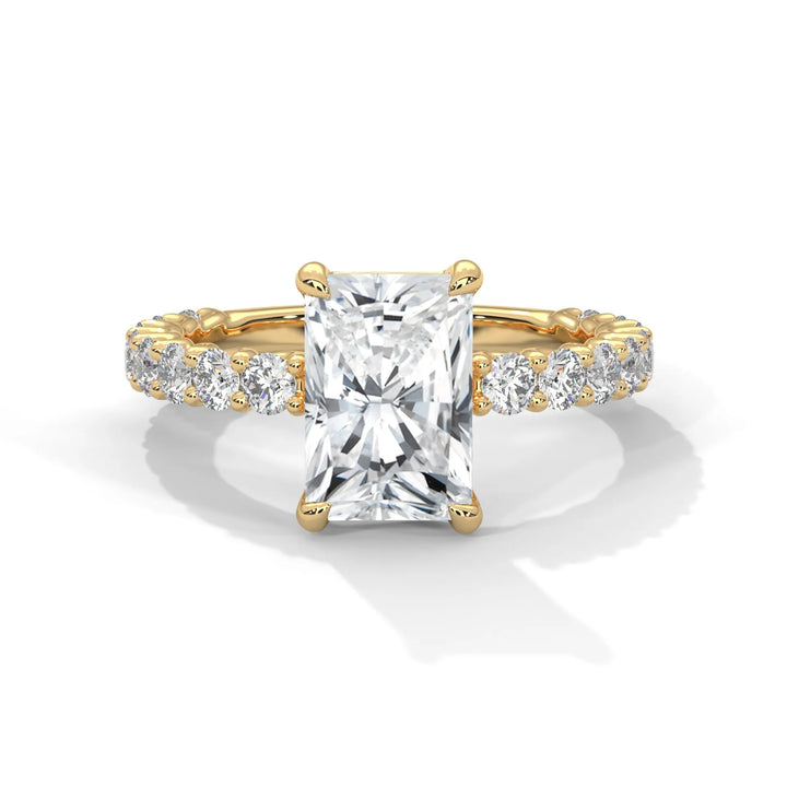 A stunning radiant cut diamond engagement ring in a bubble setting, crafted from 14k yellow gold for a luxurious touch.