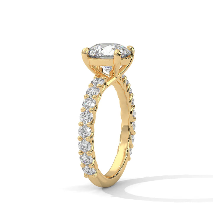 An elegant round diamond engagement ring crafted in 14k yellow gold, highlighted by a bubble setting for a captivating 3D appearance.