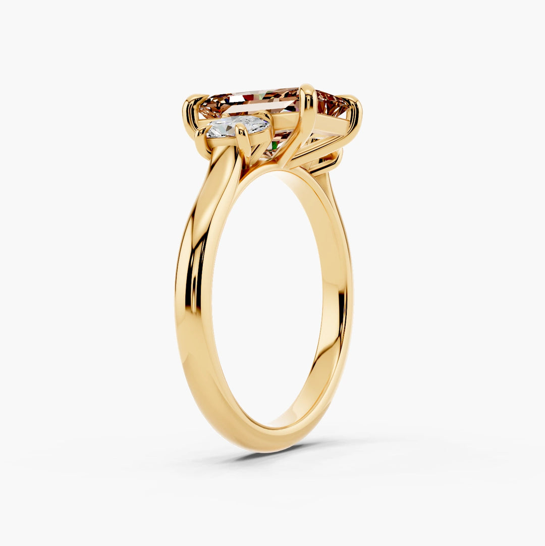 Celeste Oval Trilogy Champagne Setting Radiant cut engagement ring in 14k Yellow Gold persp