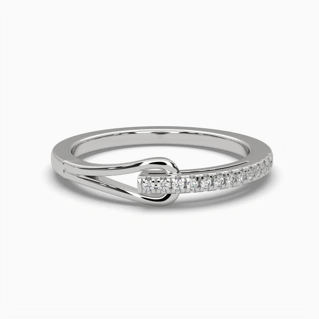 A gold ring featuring a diamond knot design with lab-grown diamonds on the band.