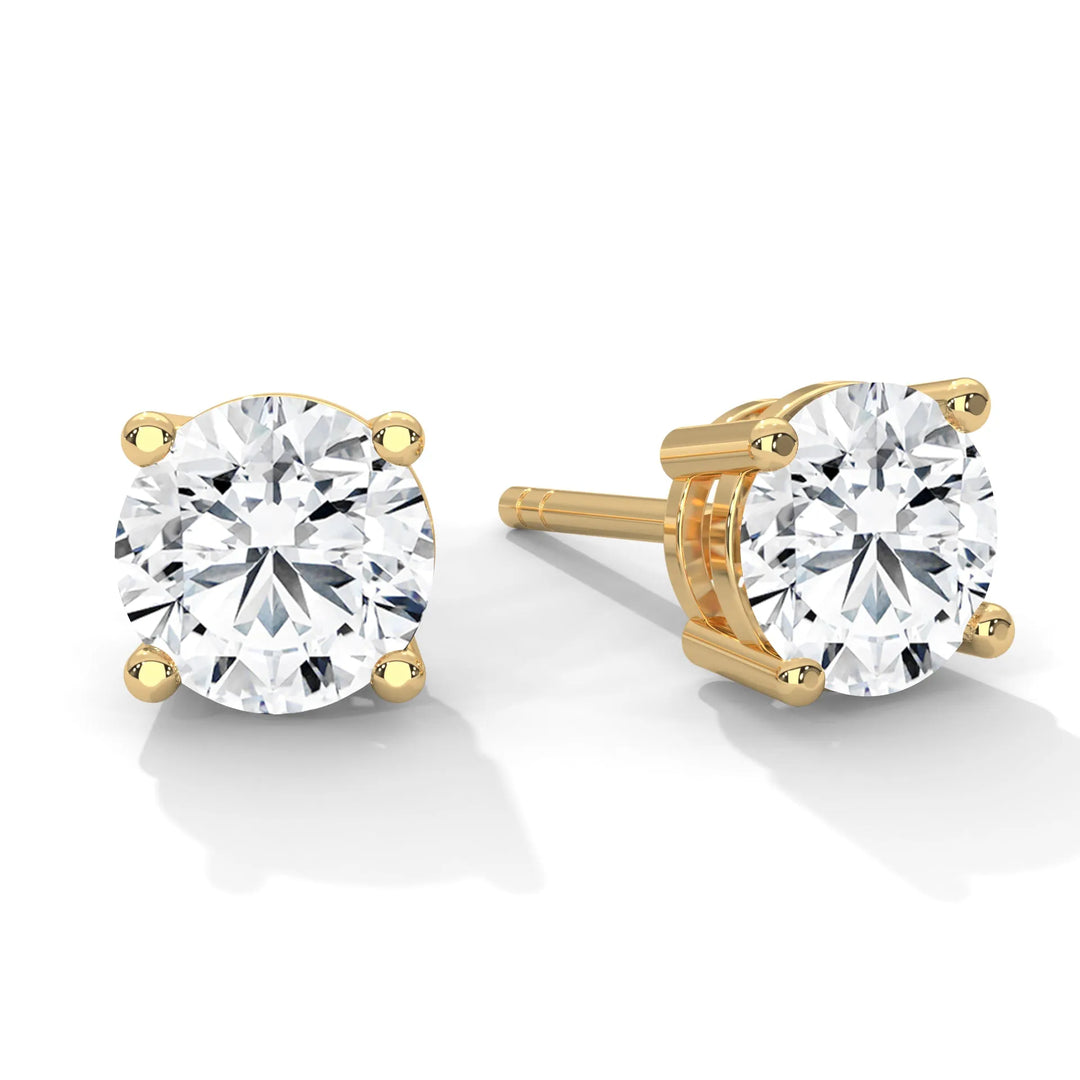 Diamond stud earrings crafted in yellow gold showcasing elegance and sophistication in a timeless design.