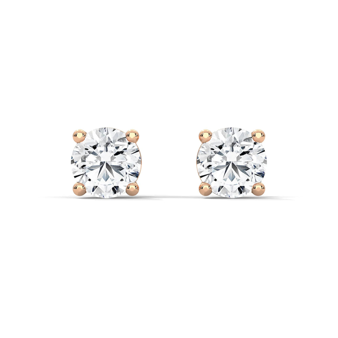 Diamond stud earrings set in elegant 18k rose gold sparkling and perfect for any special occasion or everyday wear.