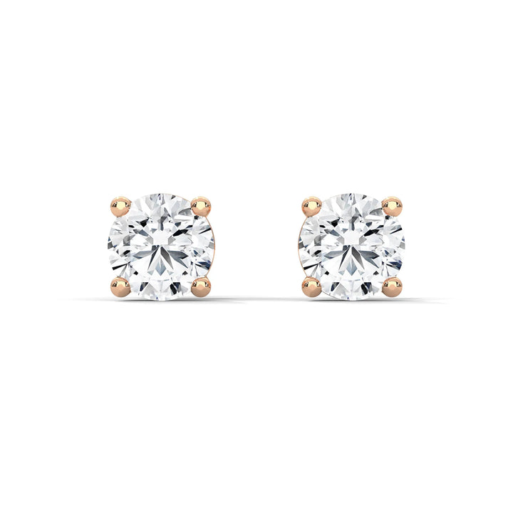 Diamond stud earrings set in elegant 18k rose gold sparkling and perfect for any special occasion or everyday wear.