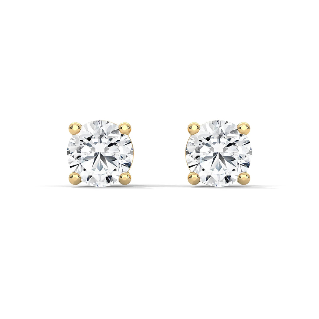 Diamond stud earrings set in yellow gold sparkling and elegant perfect for adding a touch of luxury to any outfit.