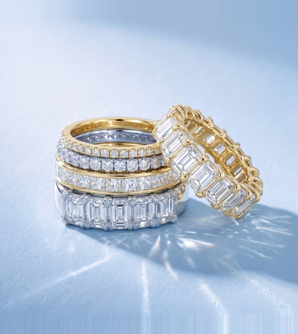Diamond wedding bands in white and yellow gold &mdash; eternity and emerald-cut styles