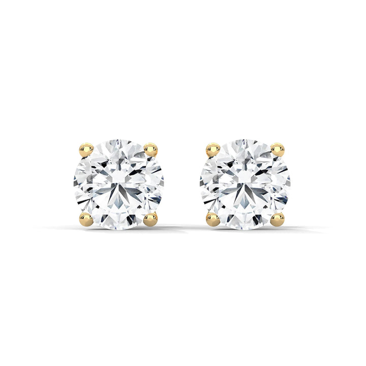 Elegant diamond stud earrings set in 18k yellow gold radiating timeless beauty and sophistication