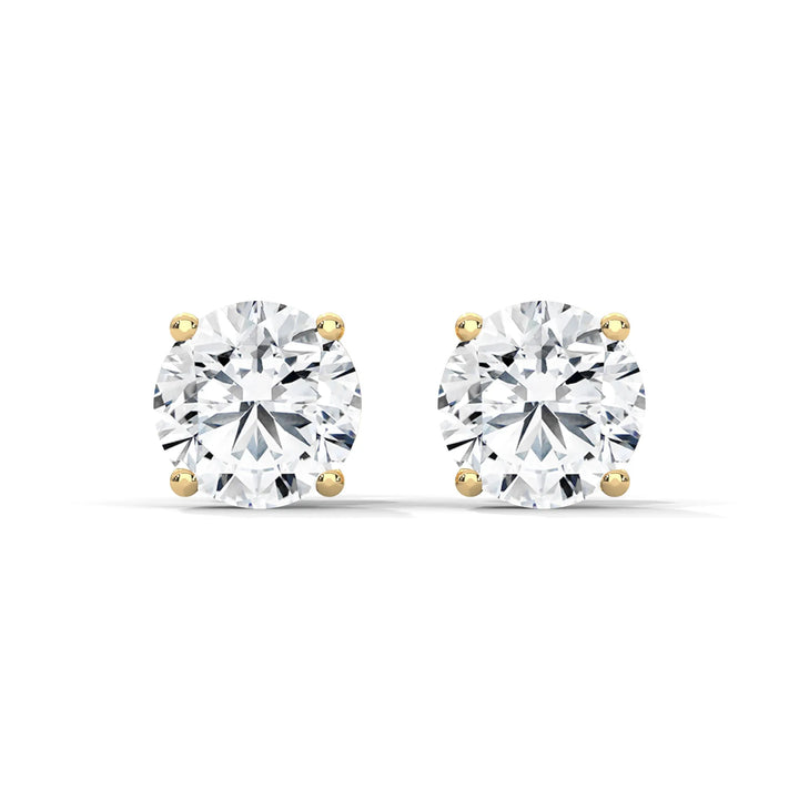 Elegant diamond stud earrings set in 18k yellow gold showcasing a timeless design and exquisite craftsmanship.