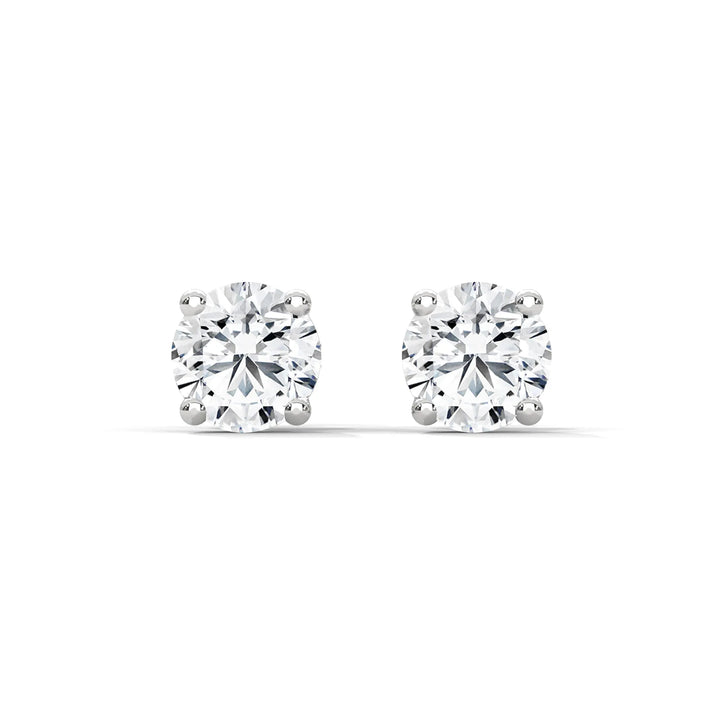 Elegant diamond stud earrings set in lustrous white gold radiating timeless sophistication and exquisite craftsmanship.