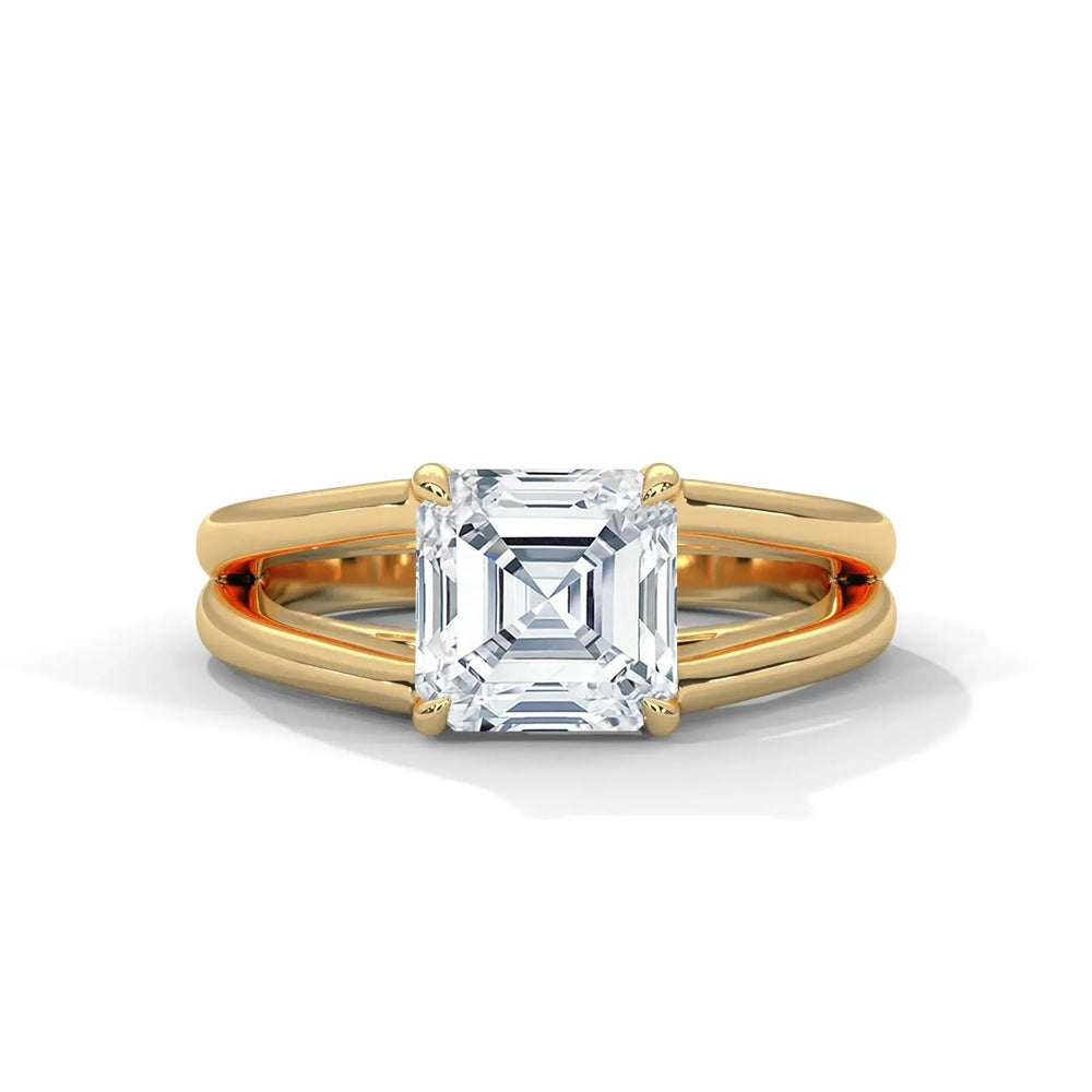 Elegant gold ring with a large square-cut diamond centerpiece. The design features a split shank, adding sophistication and a luxurious feel.