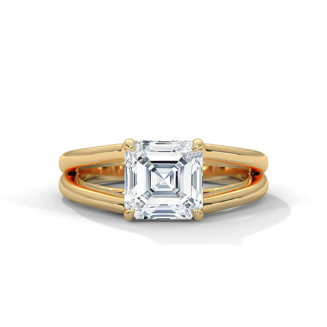 Elegant gold ring with a large square-cut diamond centerpiece. The design features a split shank, adding sophistication and a luxurious feel.