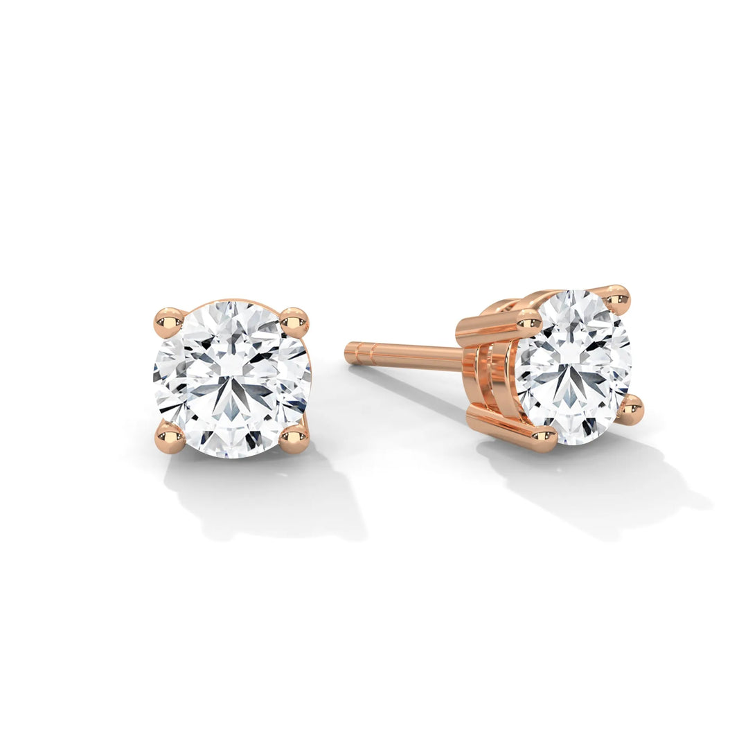 Elegant rose gold diamond stud earrings showcasing a timeless design that adds a touch of sophistication to any outfit.