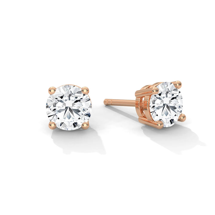 Elegant rose gold diamond stud earrings sparkling with brilliance, perfect for adding a touch of luxury to any outfit.