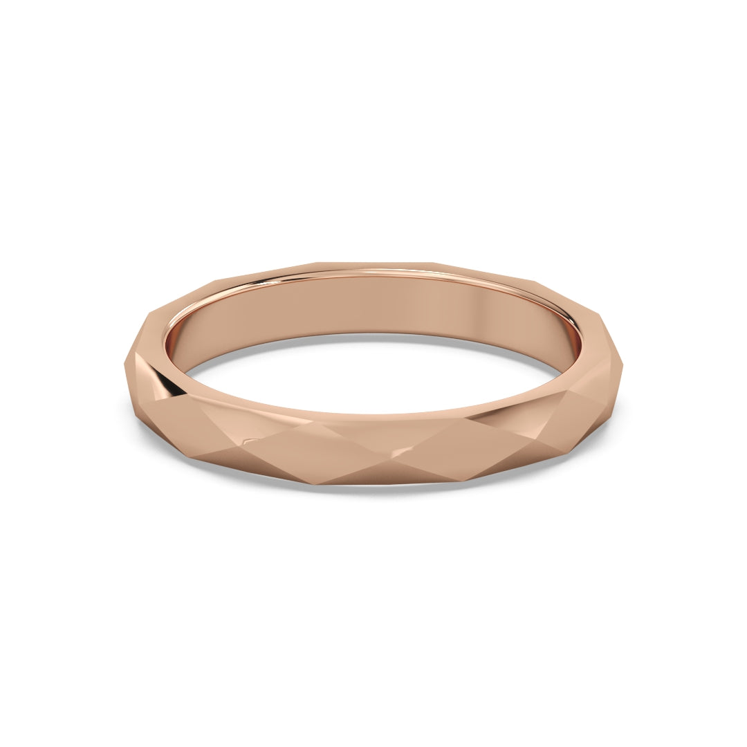 Elegant rose gold ring with a faceted design, reflecting light beautifully against a clean white background.