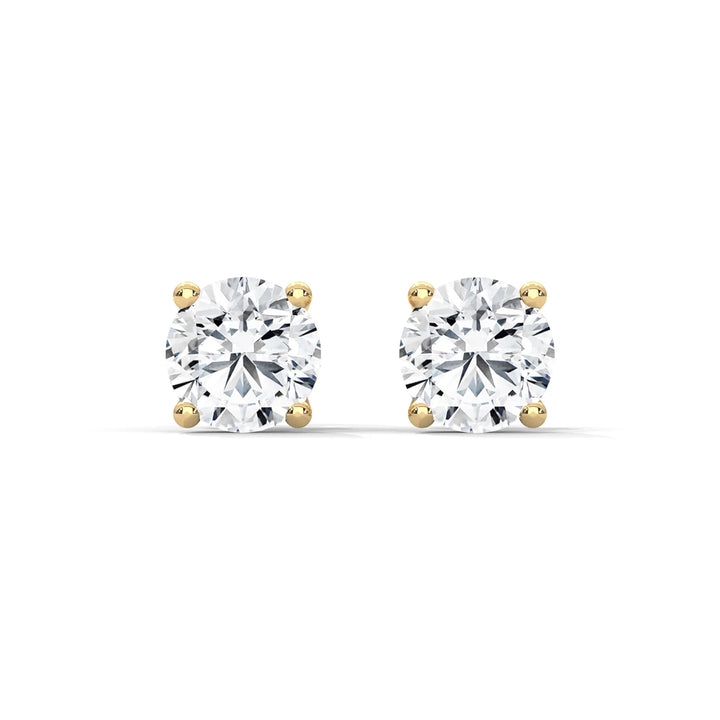 Elegant yellow gold diamond stud earrings sparkling with brilliance, perfect for adding a touch of luxury to any outfit.