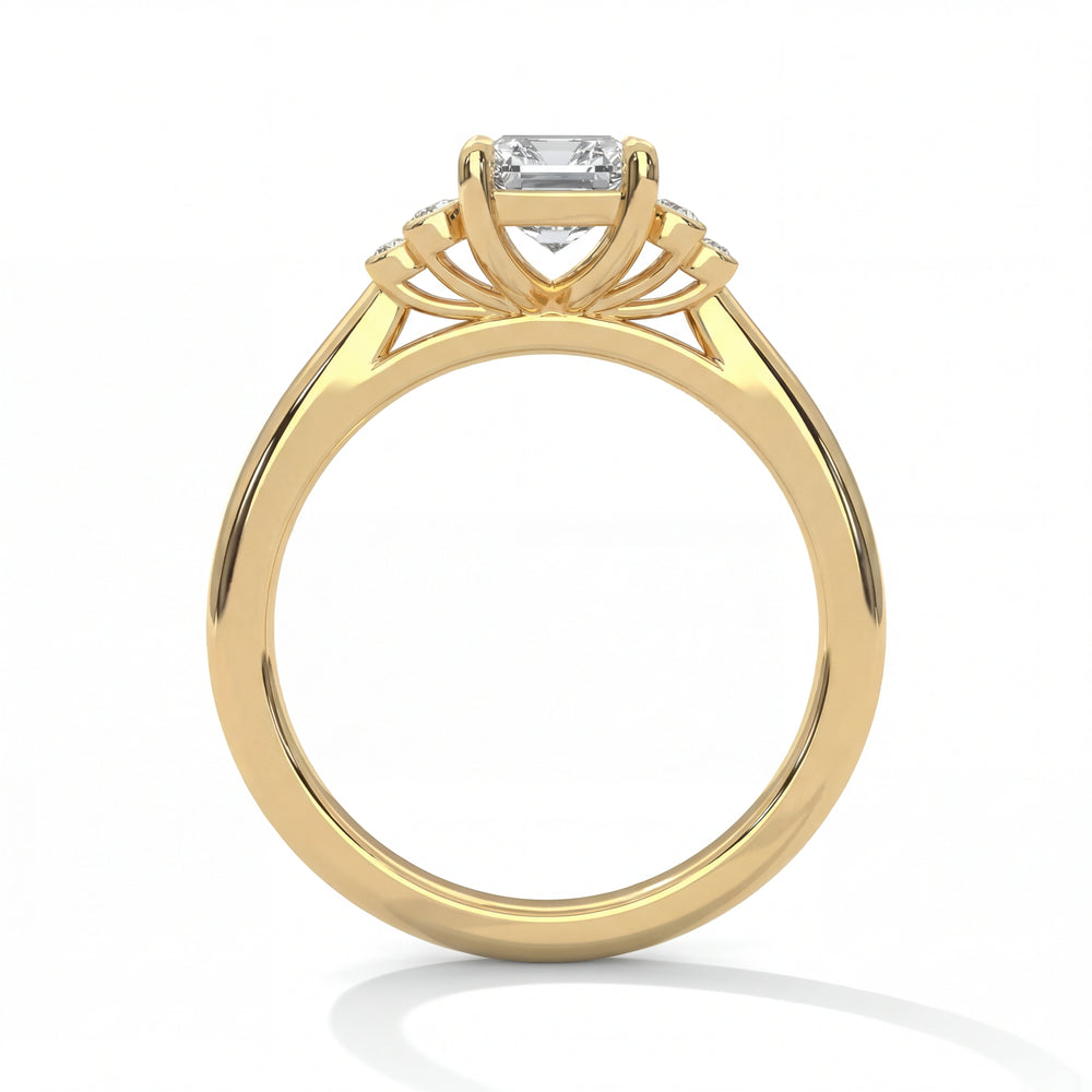 Side profile view of emerald cut diamond engagement ring in yellow gold with architectural openwork gallery and classic solitaire setting