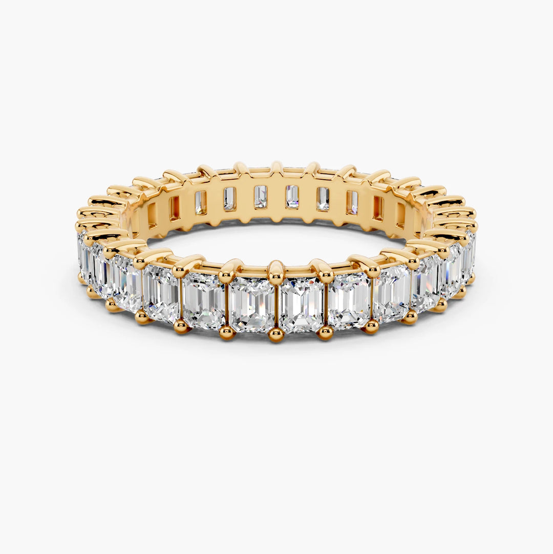 2 carat emerald cut diamond eternity band in yellow gold, face up view