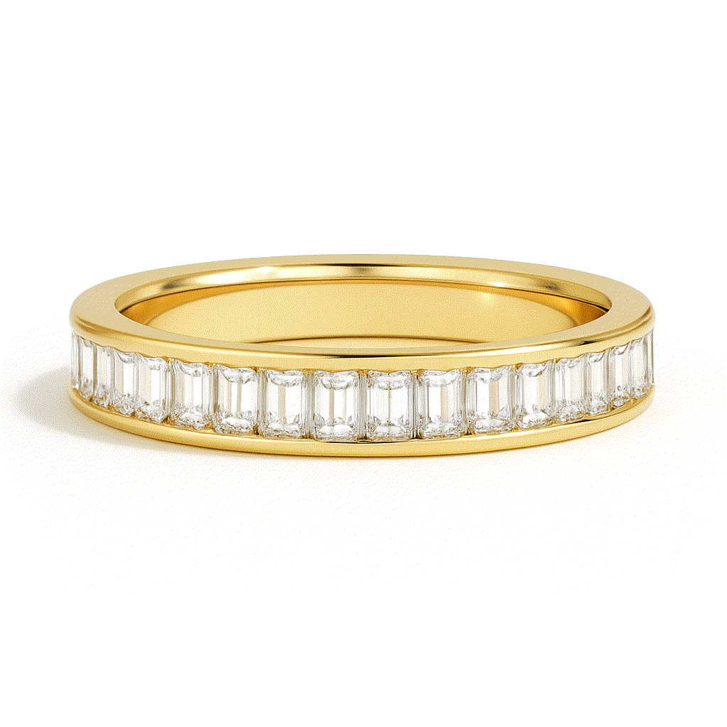 A gold band ring adorned with a row of rectangular diamonds set around its circumference. The ring exudes elegance and sophistication against a white background.