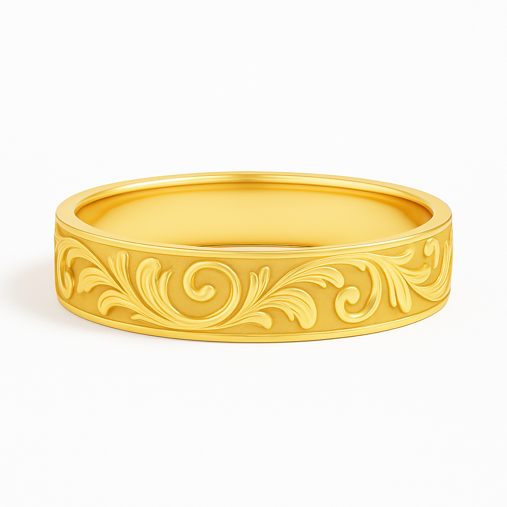 A gold bracelet with intricate, raised floral engravings against a smooth background, symbolizing elegance and classic design on plain white.