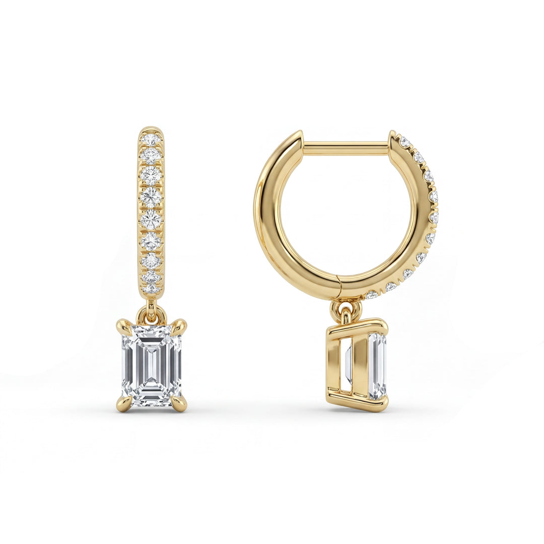 Gold emerald-cut diamond pave hoop earrings. Delicate and elegant diamond drop hoops for a touch of sparkle.