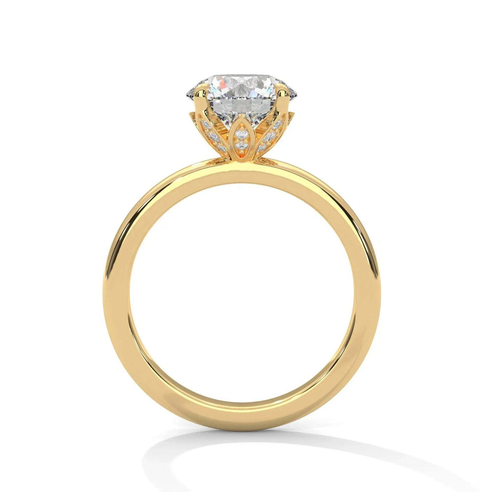 Gold engagement ring with a large, round diamond set in an ornate prong setting. The design is elegant, showcasing brilliance and luxury.