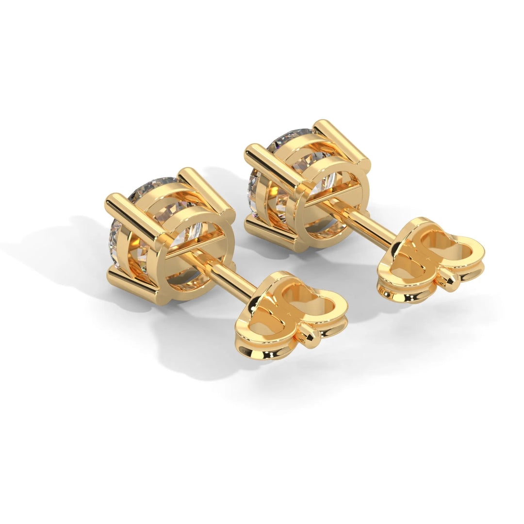 Gold plated stud earrings adorned with sparkling diamonds showcasing elegance and sophistication in a timeless design.