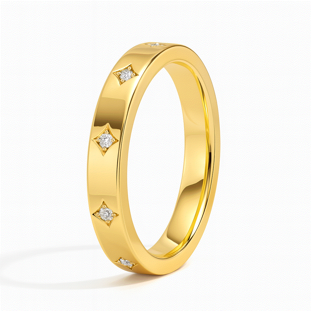 A gold ring adorned with small diamond stars evenly spaced around the band, reflecting light on a white background, exuding elegance and luxury.
