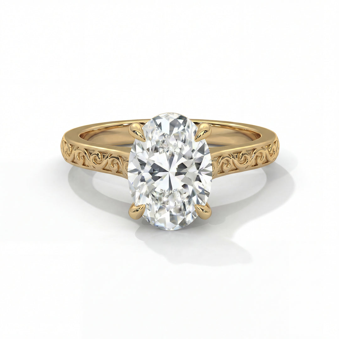 A gold ring featuring an intricately carved band and a large, oval-cut diamond in a prong setting. The ring exudes elegance and sophistication.