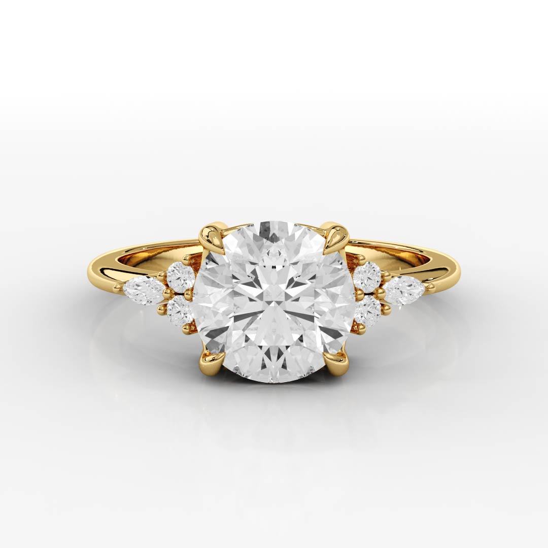 Gold ring with a large diamond and smaller diamonds on the sides against a white background