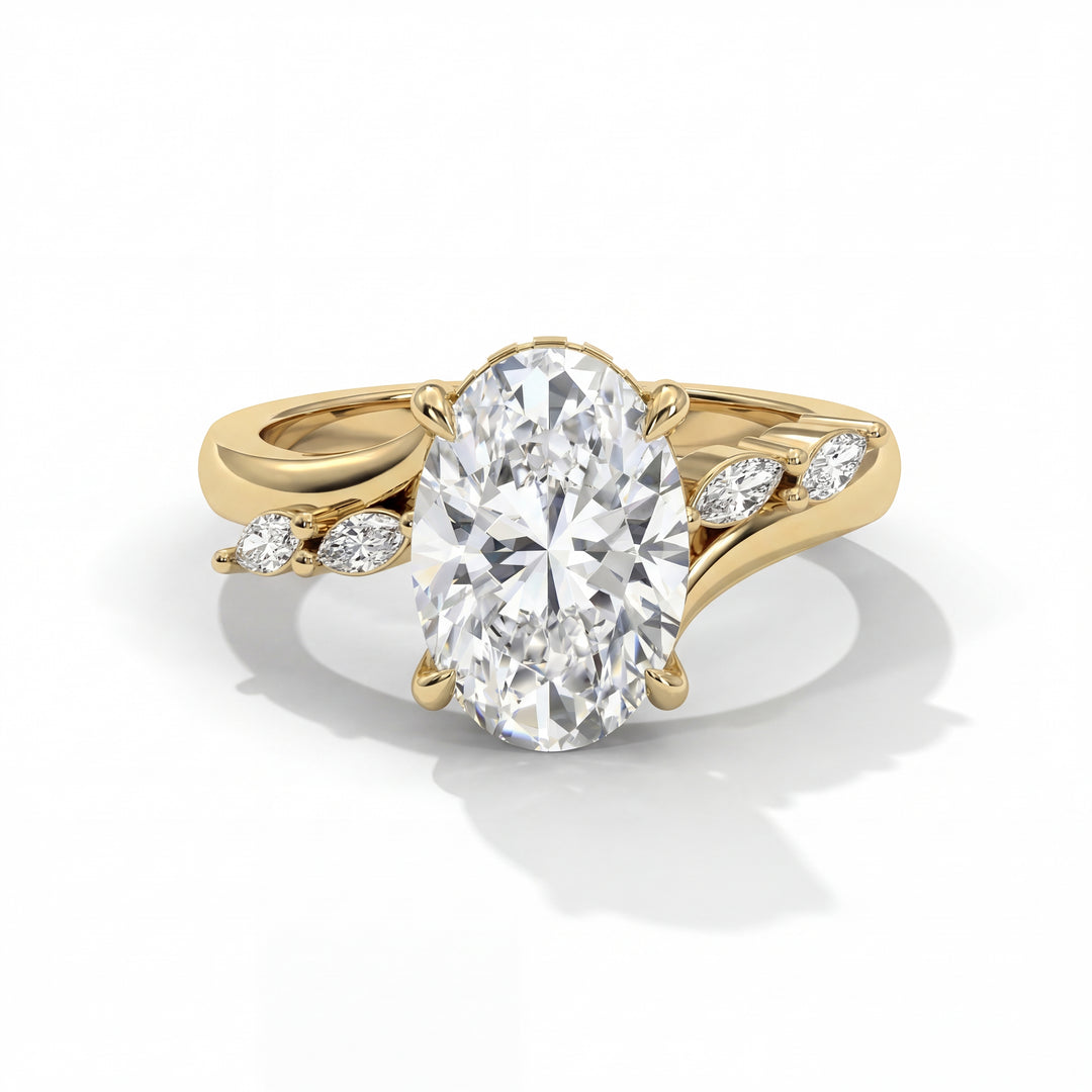 Gold ring with a large oval diamond centerpiece and small marquise side stones. The elegant design conveys luxury and sophistication.