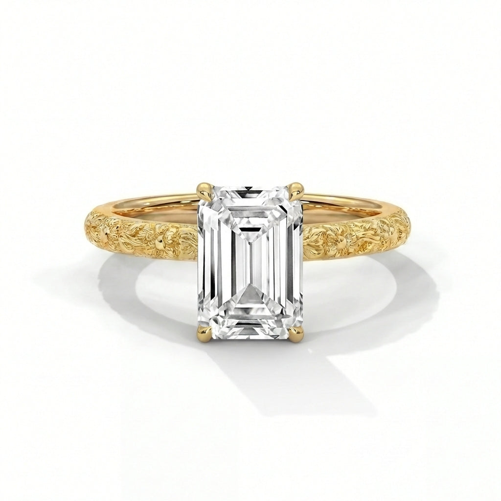 Gold ring with a large rectangular diamond on a white background