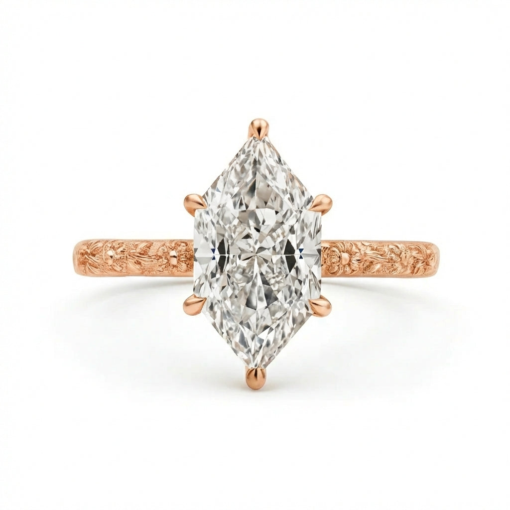 Rose gold ring with a pear-shaped diamond on a white background
