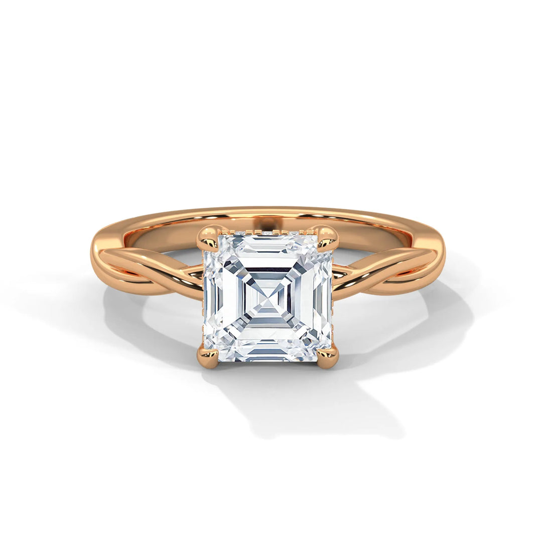 A stunning 14k rose gold engagement ring with a asscher cut diamond, beautifully crafted in the Kosina setting.