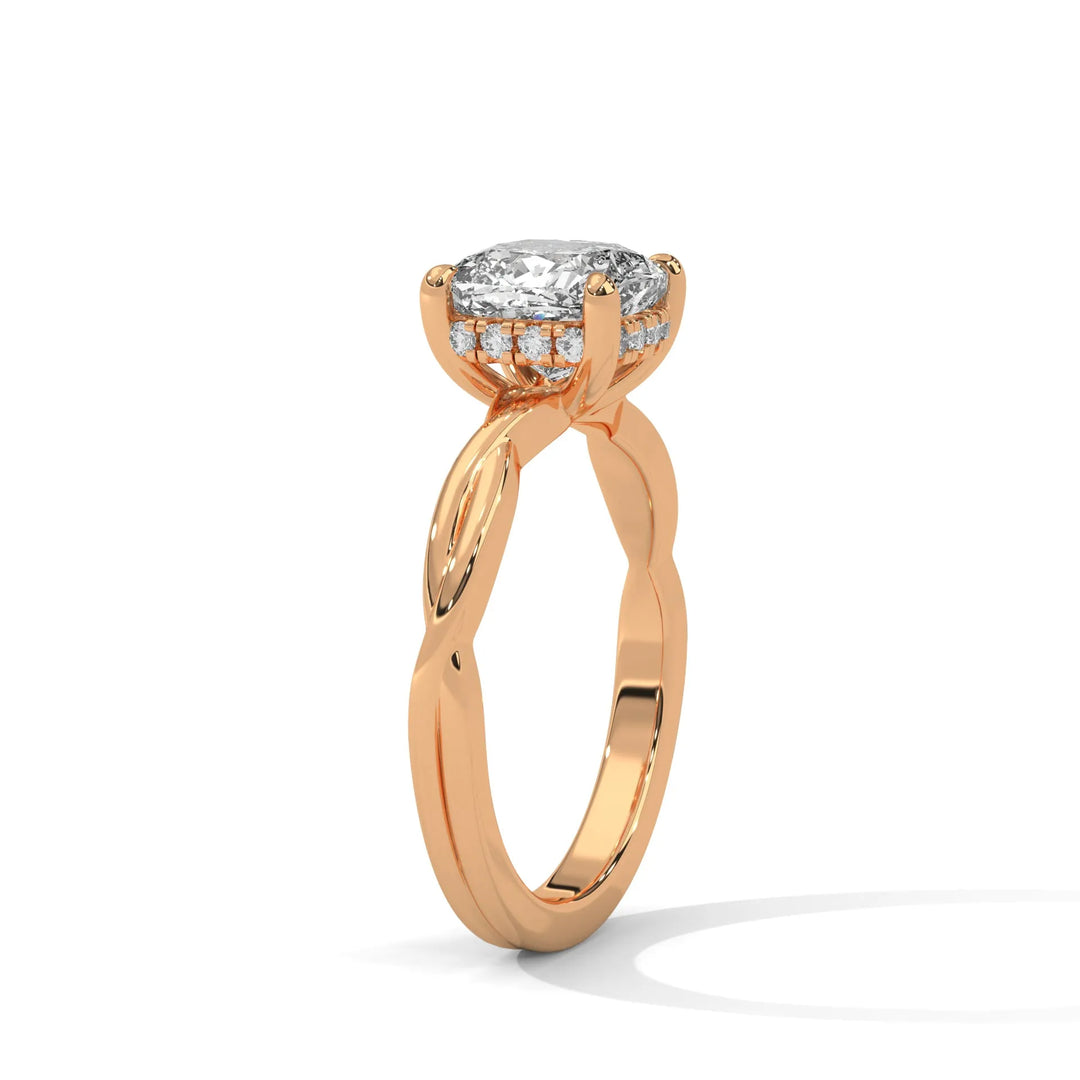 A rose gold engagement ring adorned with a cushion cut diamond center, exemplifying the refined Kosina setting craftsmanship.